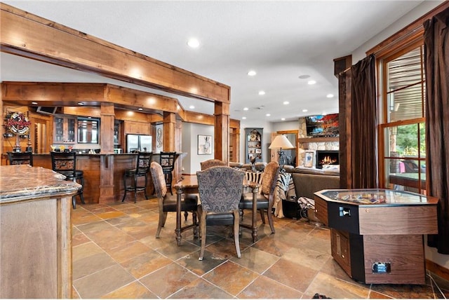 dining space featuring a fireplace