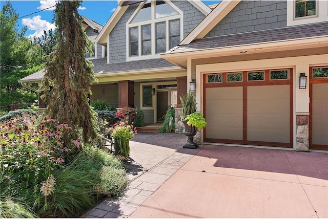 view of front facade featuring a porch and a garage