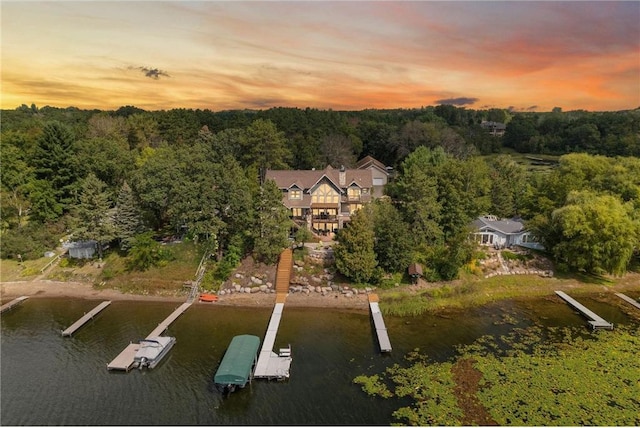 aerial view at dusk with a water view