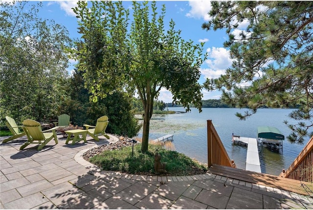 exterior space with a boat dock and a water view