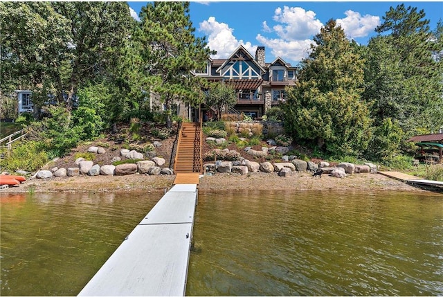 view of dock with a deck with water view