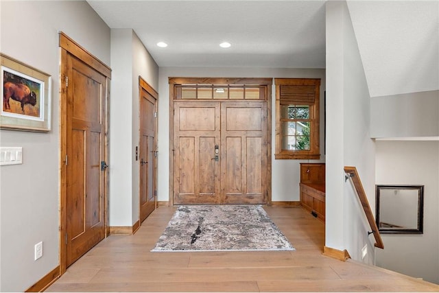 foyer with light hardwood / wood-style flooring and a textured ceiling