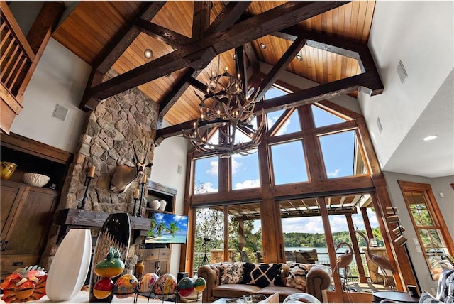 living room with beamed ceiling, high vaulted ceiling, and wooden ceiling