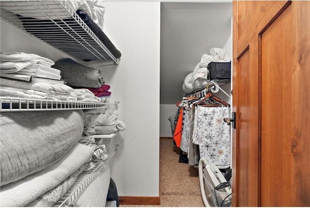 walk in closet featuring carpet