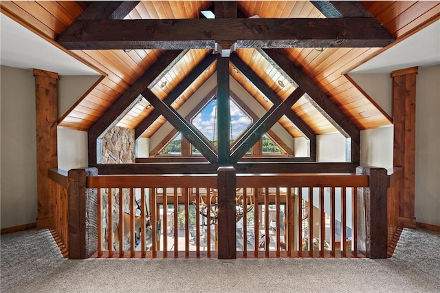 details featuring carpet floors, beamed ceiling, and wood ceiling