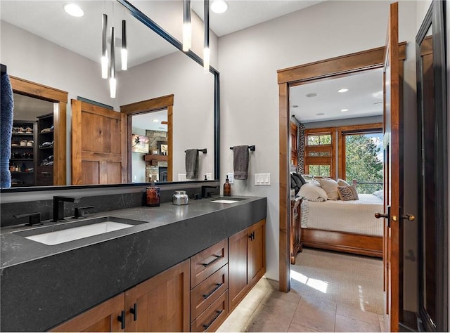 bathroom with tile patterned flooring and vanity