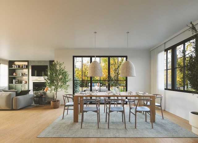 dining space with light wood-type flooring