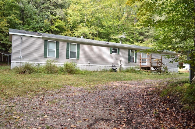 view of front of property featuring a wooden deck