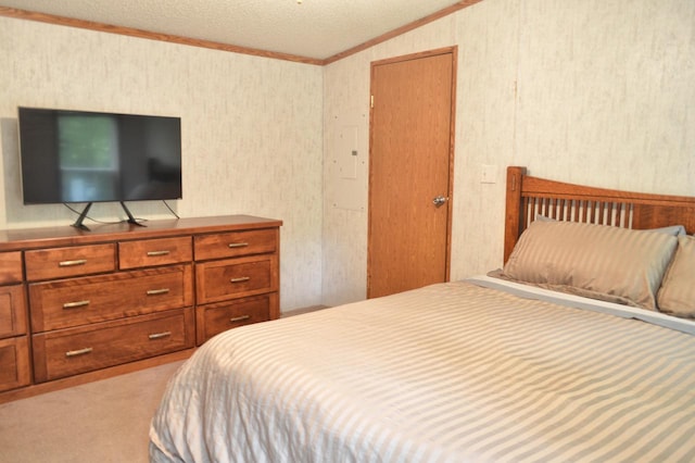 bedroom featuring light carpet, a textured ceiling, lofted ceiling, and ornamental molding