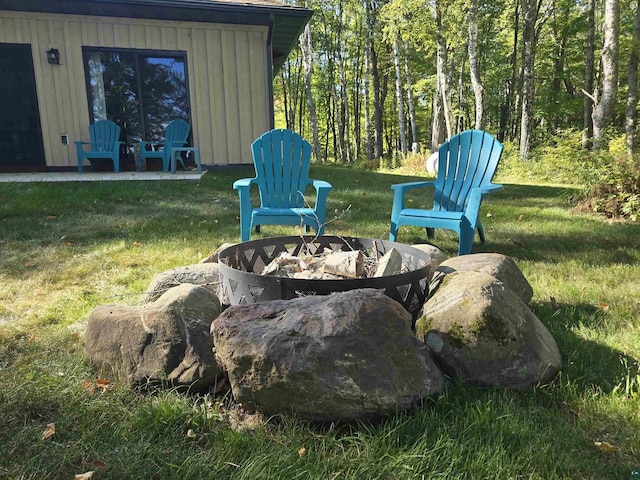 view of yard with an outdoor fire pit