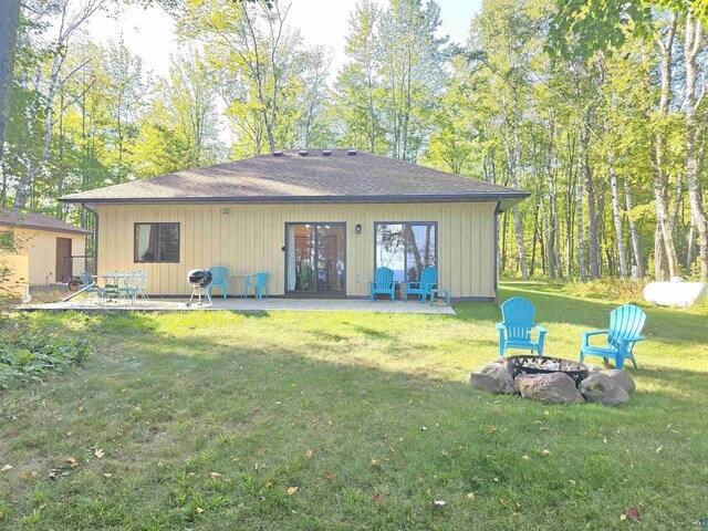 view of outbuilding featuring a lawn