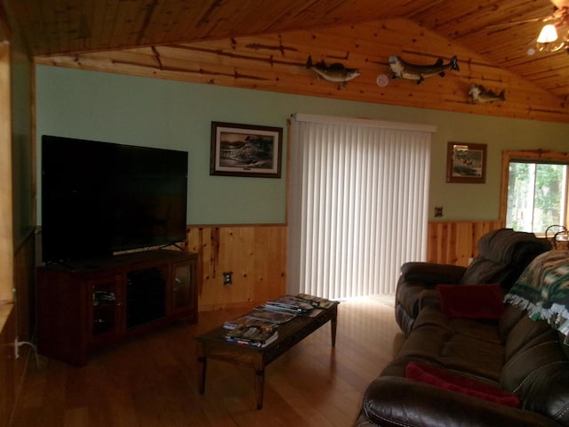 living room with wood walls, wood ceiling, vaulted ceiling, and hardwood / wood-style flooring