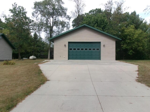 garage featuring a yard