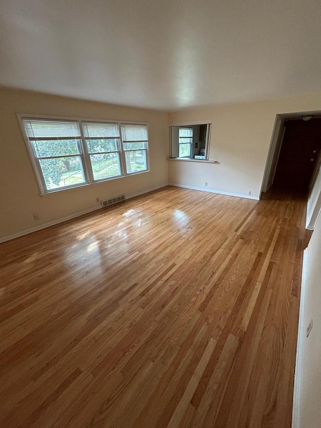 spare room featuring light hardwood / wood-style floors