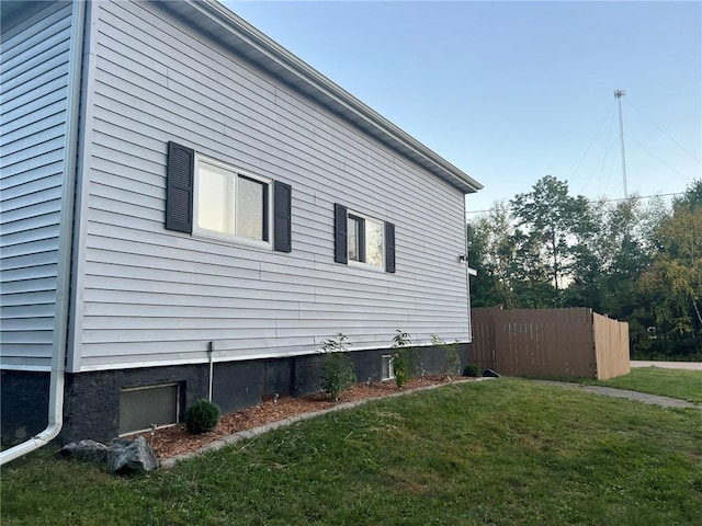 view of home's exterior featuring a yard