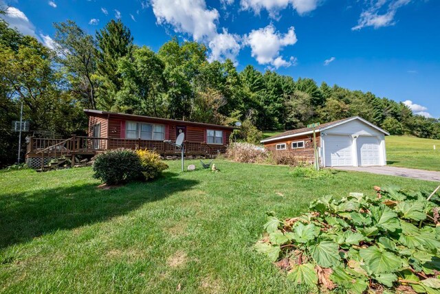 view of yard with a wooden deck