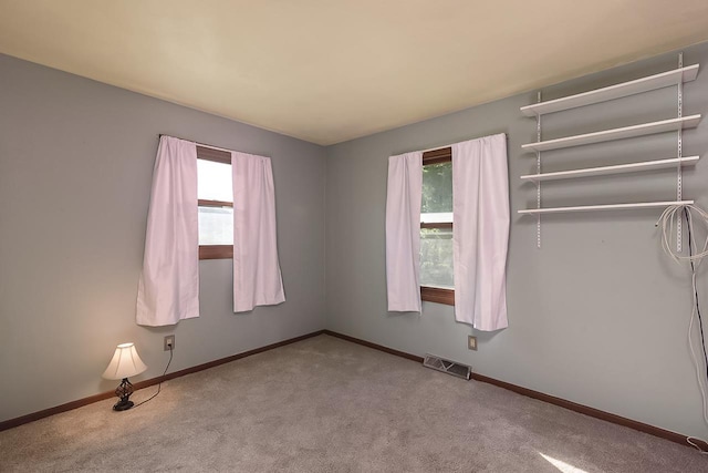 unfurnished bedroom with light carpet