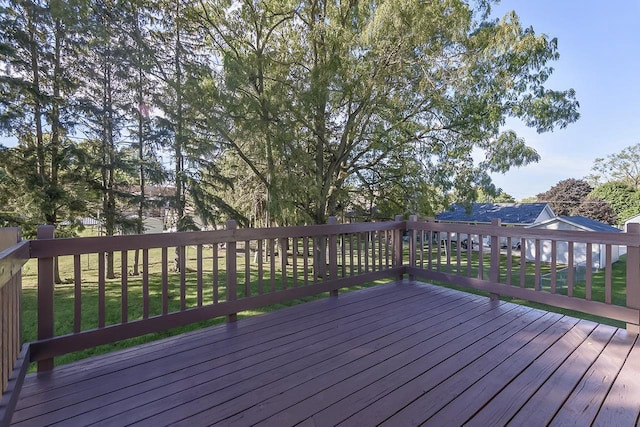 wooden terrace with a lawn