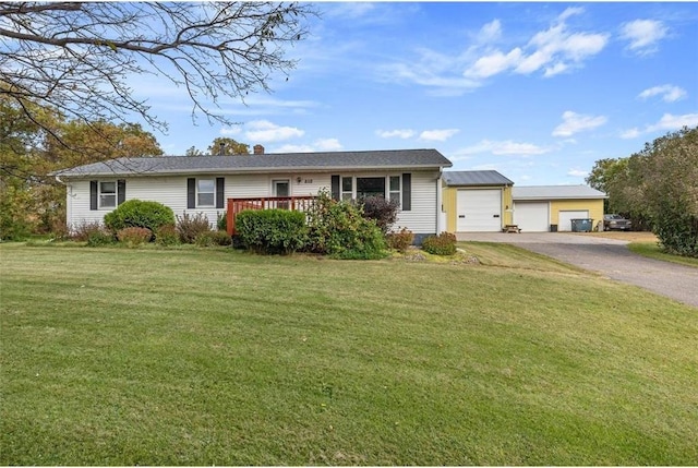 ranch-style home featuring a garage and a front yard