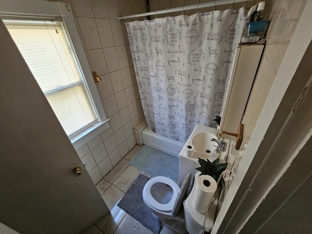 bathroom featuring walk in shower, tile walls, toilet, and tile patterned floors