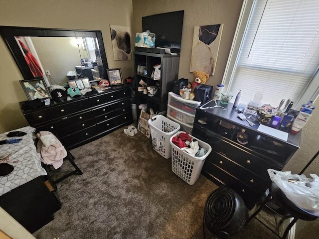 bedroom featuring dark carpet