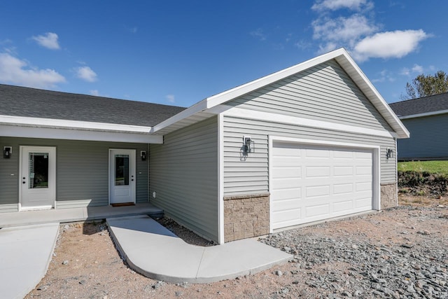 exterior space with covered porch and stone siding