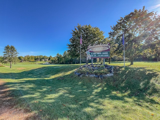 view of home's community with a lawn