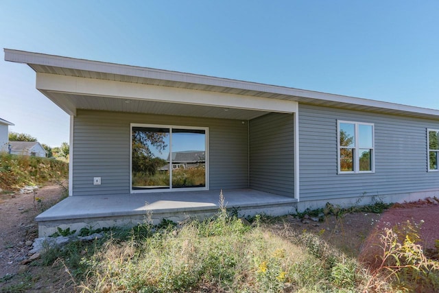 back of property with a patio area