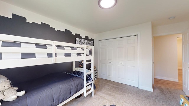 carpeted bedroom featuring a closet