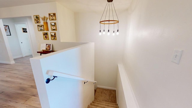 staircase with hardwood / wood-style flooring