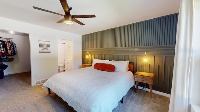 carpeted bedroom with ceiling fan, a closet, and connected bathroom