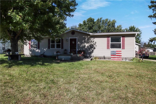 view of front of property with a front lawn