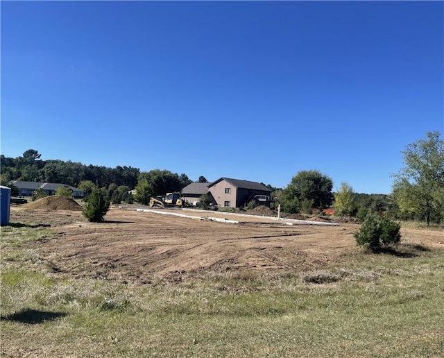 view of yard with a rural view