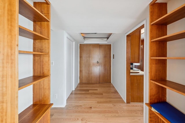 hall with light wood-type flooring