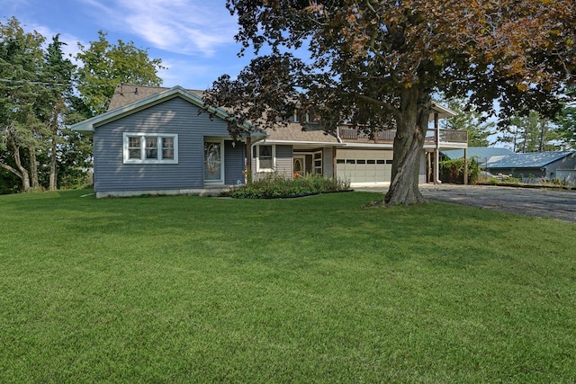 view of front of property with a garage and a front yard