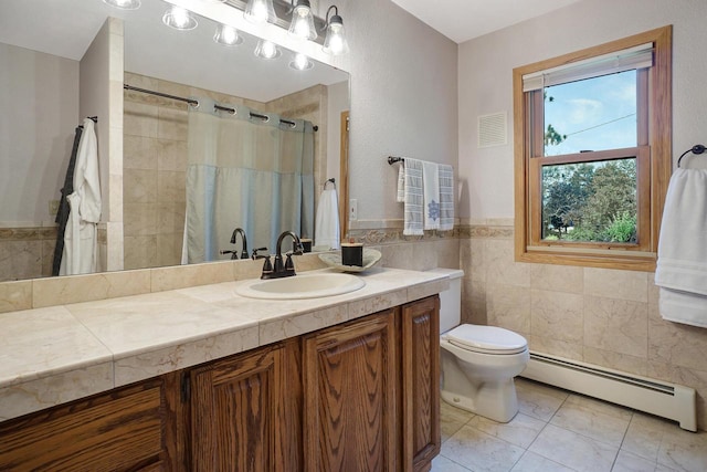 bathroom featuring vanity, a baseboard radiator, tile walls, and toilet