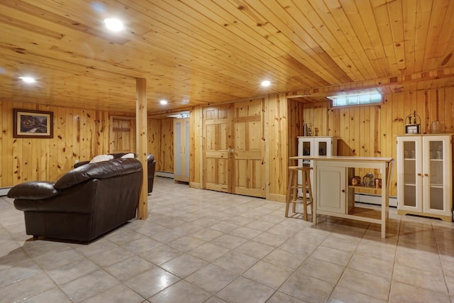 living room featuring wood ceiling, wood walls, and baseboard heating