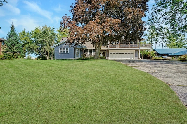 view of front facade with a garage and a front yard