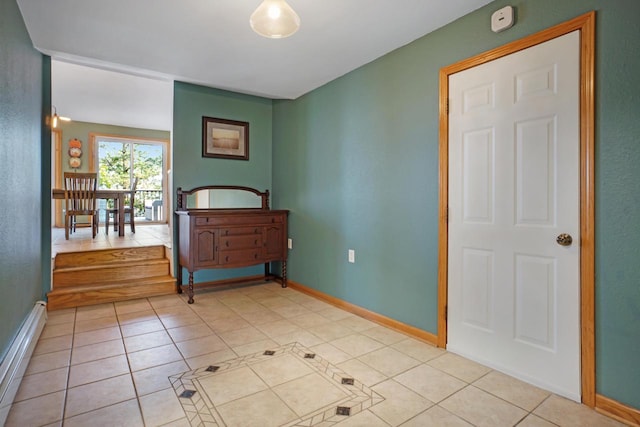 interior space featuring a baseboard radiator and light tile patterned floors