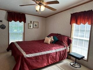 bedroom featuring ornamental molding and ceiling fan