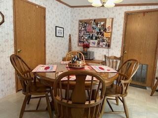 dining room featuring ornamental molding