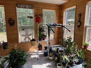 workout room with wood walls