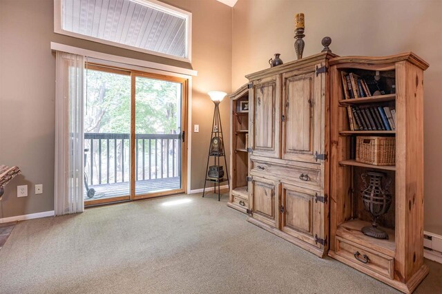 carpeted living room featuring high vaulted ceiling