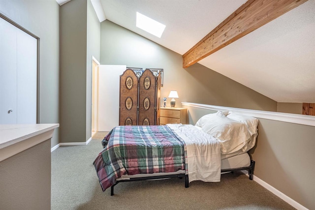 bedroom featuring light colored carpet and vaulted ceiling with skylight