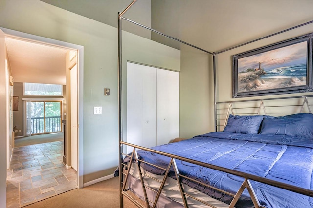 carpeted bedroom featuring a closet