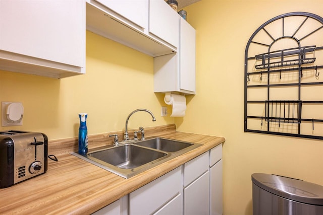 kitchen with white cabinets and sink