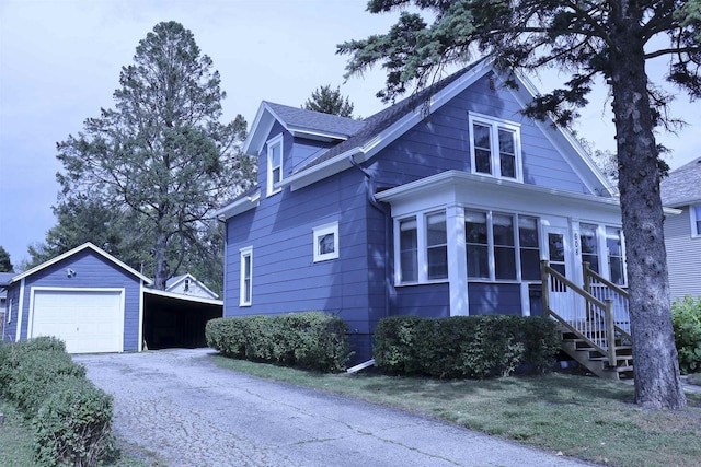 view of front of home with an outbuilding and a garage