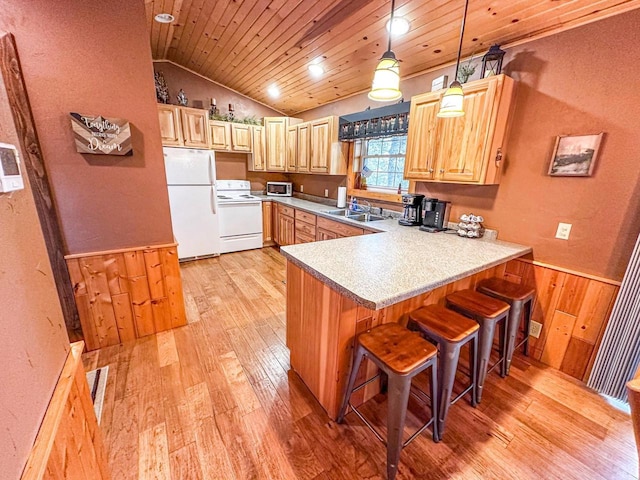 kitchen with pendant lighting, light wood-type flooring, white appliances, and wooden ceiling