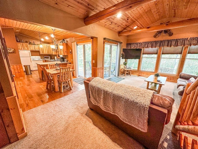 bedroom featuring white fridge, lofted ceiling with beams, wooden ceiling, light wood-type flooring, and access to exterior