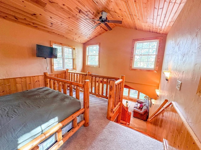 bedroom with wood ceiling, lofted ceiling, multiple windows, and carpet floors